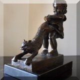 A18. Bronze of girl dragging an unwilling cat signed Juan Clara. Marble base. 9.5”h
